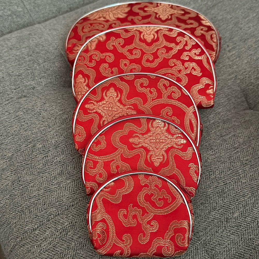 Five (5) pieces makeup/travel bags nwt in package red brocade fabric silver trim
